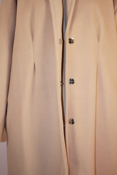 Champagne-colored coat with turtleneck and press studs
