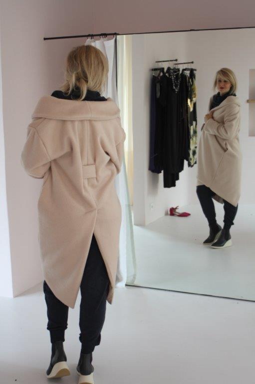 Champagne-colored coat with turtleneck and press studs
